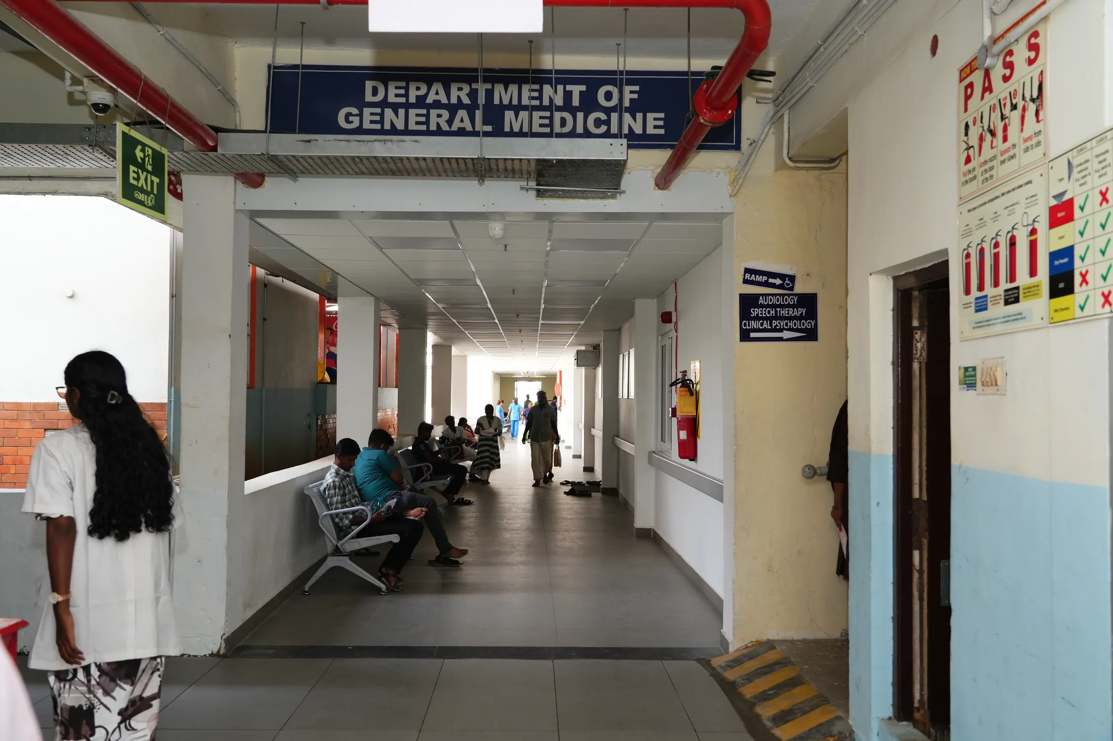 Patients waiting in the Department of General Medicine corridor at AVMCH Hospital